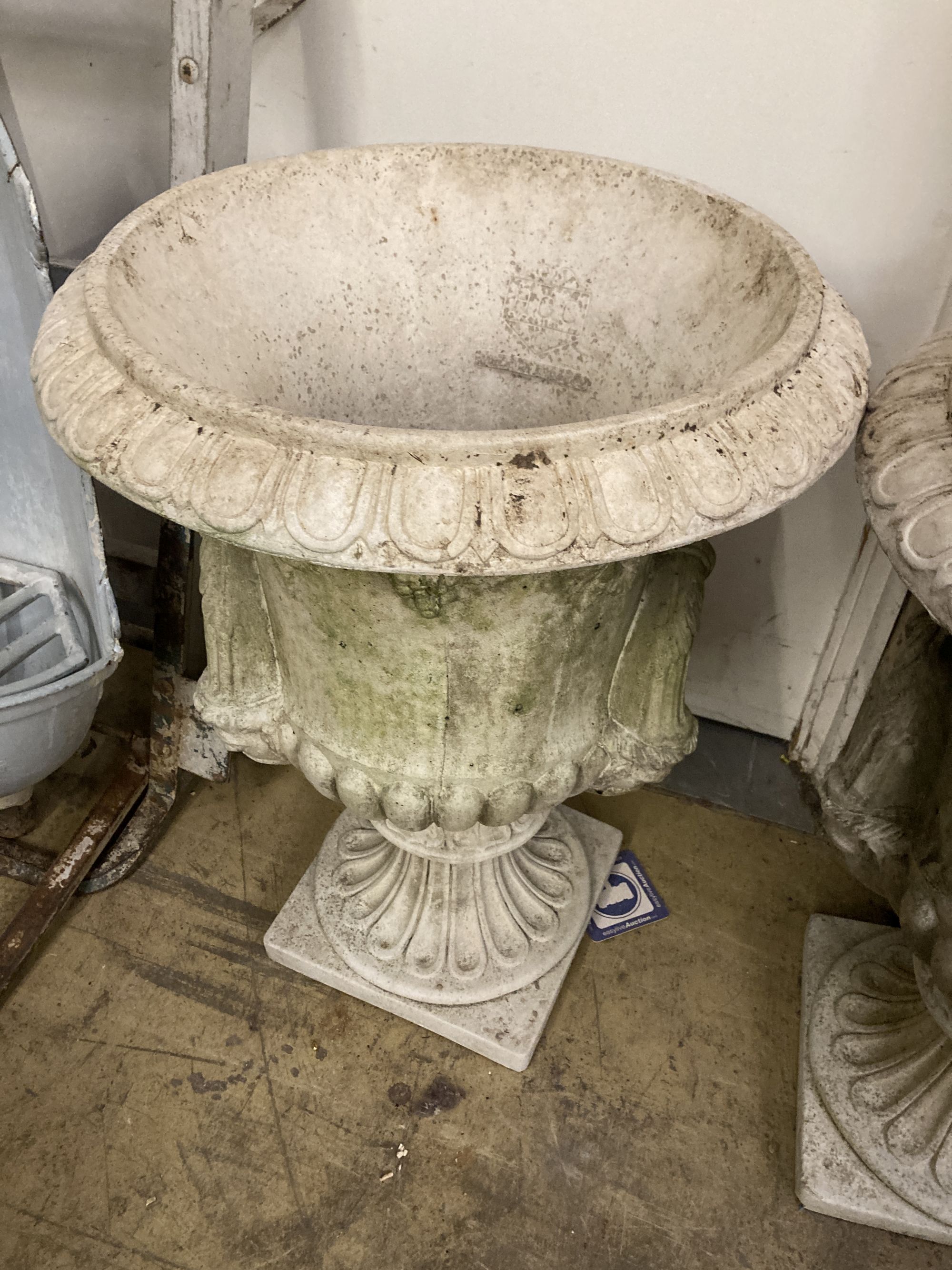 A pair of reconstituted stone campana shaped garden urns, diameter 54cm, height 72cm